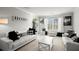 Elegant living room with ample natural light and stylish decor at 423 Blackbird Way, Hampton, GA 30228