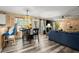 Open living area with dining table and living room seating at 423 Blackbird Way, Hampton, GA 30228