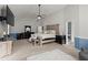 Spacious primary bedroom featuring a ceiling fan, a TV, and elegant decor at 423 Blackbird Way, Hampton, GA 30228