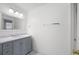 Well-lit bathroom features a vanity with marble countertop and a large mirror at 1382 Benbrooke Nw Ln, Acworth, GA 30101