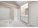 Bathroom featuring a vanity, tub, tiled floor, and natural lighting at 1382 Benbrooke Nw Ln, Acworth, GA 30101