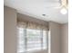 Bedroom window with blinds and a valance with palm tree motif at 1382 Benbrooke Nw Ln, Acworth, GA 30101
