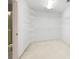 Spacious walk-in closet with adjustable shelving for optimal organization at 1382 Benbrooke Nw Ln, Acworth, GA 30101