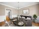 Formal dining room with wainscotting, chandelier, and seating for eight at 1382 Benbrooke Nw Ln, Acworth, GA 30101