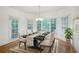 Cozy dining room with natural light, modern chandelier, and dining set for elegant meals at 1382 Benbrooke Nw Ln, Acworth, GA 30101