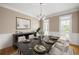 Formal dining room with wainscotting, chandelier, and seating for eight at 1382 Benbrooke Nw Ln, Acworth, GA 30101