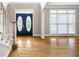 Inviting foyer with gleaming hardwood floors and a decorative glass front door at 1382 Benbrooke Nw Ln, Acworth, GA 30101