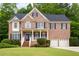 Charming brick home with a well-manicured lawn and a two-car garage at 1382 Benbrooke Nw Ln, Acworth, GA 30101