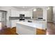 Bright kitchen featuring stainless appliances, island, and ample counter space at 1382 Benbrooke Nw Ln, Acworth, GA 30101