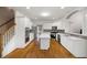 Bright kitchen featuring stainless appliances, island, and ample counter space at 1382 Benbrooke Nw Ln, Acworth, GA 30101