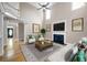Bright living room with fireplace and hardwood floors leading to entry at 1382 Benbrooke Nw Ln, Acworth, GA 30101