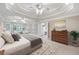 Tranquil main bedroom with a trey ceiling, serene decor, and a sitting area at 1382 Benbrooke Nw Ln, Acworth, GA 30101