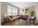 Cozy home office with a comfortable couch, desk and plenty of natural light at 1382 Benbrooke Nw Ln, Acworth, GA 30101