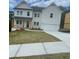 Charming two-story home with white siding, a covered porch, and a two-car garage at 171 Silvercrest Dr, Acworth, GA 30101