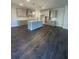 Spacious kitchen with ample counter space, modern appliances, and dark hardwood floors at 171 Silvercrest Dr, Acworth, GA 30101