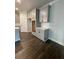 Bright kitchen features white cabinets, light counter tops, and modern appliances at 171 Silvercrest Dr, Acworth, GA 30101