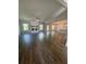 Open-concept living space with a fireplace, hardwood floors, and a view of the kitchen at 171 Silvercrest Dr, Acworth, GA 30101