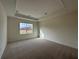This is a spacious bedroom with neutral carpeting and a large window for plenty of light at 1802 Bonica Xing # 1802, Cumming, GA 30040