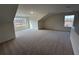 Bonus room featuring a sloped ceiling and large windows at 1802 Bonica Xing # 1802, Cumming, GA 30040