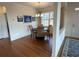 Cozy dining room featuring an elegant light fixture and hardwood floors at 1802 Bonica Xing # 1802, Cumming, GA 30040