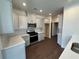 Modern kitchen with gray cabinets, stainless steel appliances, and elegant countertops at 1802 Bonica Xing # 1802, Cumming, GA 30040
