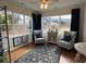 Bright sun room with large windows, hardwood floors and stylish furniture at 1802 Bonica Xing # 1802, Cumming, GA 30040