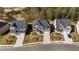 Aerial view of homes with well-kept lawns and neighborhood street at 1831 Lacebark Elm Way, Lawrenceville, GA 30045