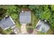 Aerial view of a home with a well-maintained roof, driveway, and lush landscaping at 2022 Maple Ridge Nw Dr, Acworth, GA 30101