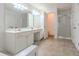 Bathroom with dual sinks, lots of counter space, and a separate shower at 2022 Maple Ridge Nw Dr, Acworth, GA 30101