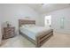 Bedroom featuring neutral carpet, a wooden bed frame, and a sign reading 'Ever After' at 2022 Maple Ridge Nw Dr, Acworth, GA 30101