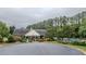 Community clubhouse with pool, surrounded by lush landscaping and trees at 2022 Maple Ridge Nw Dr, Acworth, GA 30101
