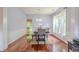 Dining area with hardwood flooring, wainscotting, and bright natural light, is perfect for entertaining guests and Gathering at 2022 Maple Ridge Nw Dr, Acworth, GA 30101
