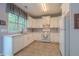 Bright kitchen with white cabinets and modern appliances at 2022 Maple Ridge Nw Dr, Acworth, GA 30101
