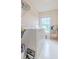 Laundry room featuring tile flooring and a front-loading washer and dryer at 2022 Maple Ridge Nw Dr, Acworth, GA 30101
