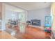 Open-concept living room and dining area features gleaming hardwood floors, natural light, and a flexible layout at 2022 Maple Ridge Nw Dr, Acworth, GA 30101