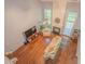 Spacious living room with hardwood floors, a fireplace, and large windows for ample natural light at 2022 Maple Ridge Nw Dr, Acworth, GA 30101