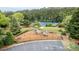 Well-maintained playground with slides and climbing structures near tennis courts and parking at 2022 Maple Ridge Nw Dr, Acworth, GA 30101