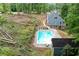 Aerial view of home with an in-ground pool surrounded by mature trees at 61 Sherwood Se Ln, Marietta, GA 30067