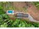 Aerial view of the property featuring a home, pool, and surrounding greenery at 61 Sherwood Se Ln, Marietta, GA 30067