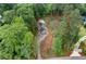 Areal view of lovely home on a sprawling lot surrounded by mature trees and featuring a private pool at 61 Sherwood Se Ln, Marietta, GA 30067