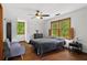 Inviting bedroom with hardwood floors, large windows, and neutral decor at 61 Sherwood Se Ln, Marietta, GA 30067
