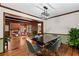 Elegant dining room featuring hardwood floors, modern lighting, and a seamless transition to the living area at 61 Sherwood Se Ln, Marietta, GA 30067