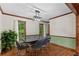 Bright dining area with natural light, hardwood flooring, and modern chandelier at 61 Sherwood Se Ln, Marietta, GA 30067