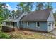 Charming home with a covered porch and two-car garage, complemented by mature landscaping and a walkway at 61 Sherwood Se Ln, Marietta, GA 30067