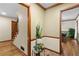 Welcoming foyer featuring hardwood floors, staircase, and decorative plants and trim, adding warmth at 61 Sherwood Se Ln, Marietta, GA 30067