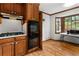 Practical kitchen layout with wooden cabinets, a built-in double oven, and a bright breakfast nook at 61 Sherwood Se Ln, Marietta, GA 30067