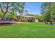 Expansive backyard with a large lawn, deck, and a trampoline provide space for outdoor activities at 305 Montevallo Dr, Atlanta, GA 30342