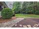 Stone pathway leads to the backyard and firepit area for outdoor relaxation and privacy at 305 Montevallo Dr, Atlanta, GA 30342