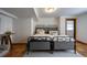 Basement bedroom with neutral decor featuring twin beds, tile flooring and access to a door at 305 Montevallo Dr, Atlanta, GA 30342
