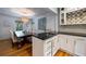 Cozy dining area featuring a wine rack, sink, and elegant lighting fixtures for a refined dining experience at 305 Montevallo Dr, Atlanta, GA 30342